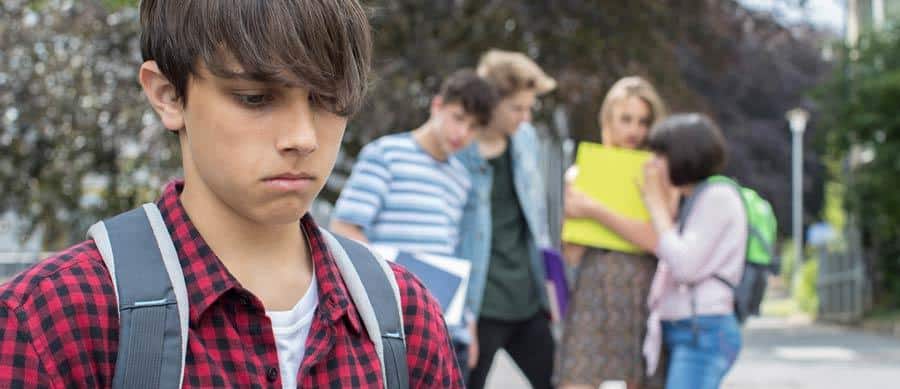 Teen boy feeling isolated due to peer pressure and risk of drug abuse