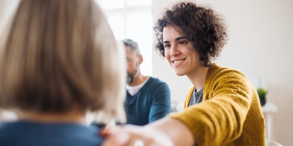 Supportive group therapy session during addiction treatment recovery