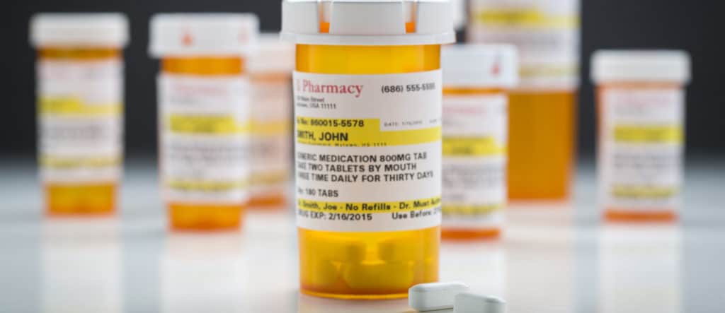 Prescription drug bottles highlighting the growing abuse crisis in Texas.