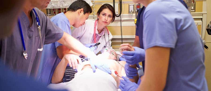 Doctors and medical team treating a patient in the emergency room due to Adderall overdose complications