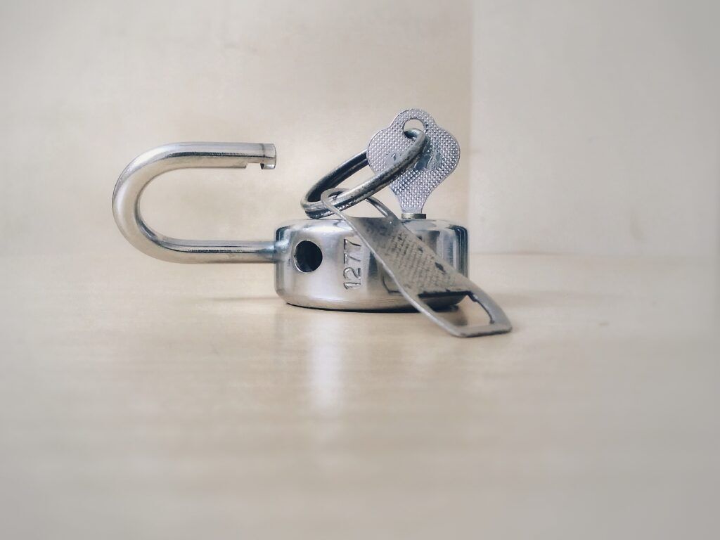 A broken padlock with its key, representing the unlocking of recovery and liberation from addiction through comprehensive drug rehab austin.