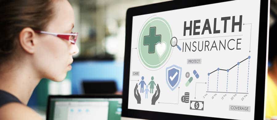 Person reviewing health insurance options for addiction treatment coverage, including MagnaCare insurance benefits for rehab services.