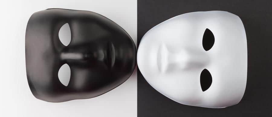 Black and white theatrical masks symbolizing addiction and personality change