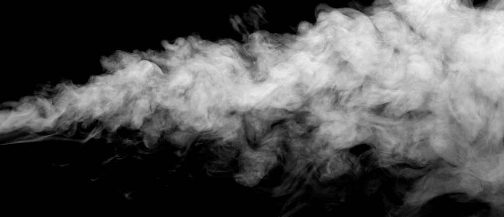 White smoke cloud against black background symbolizing the distinctive smell of drug use including crack cocaine, marijuana, and meth.