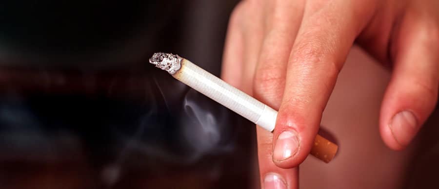 man smoking cigarette